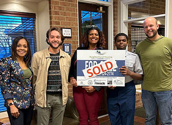 Group holding sold sign. Link to Life Stage Gift Planner Under Age 45 Situations.